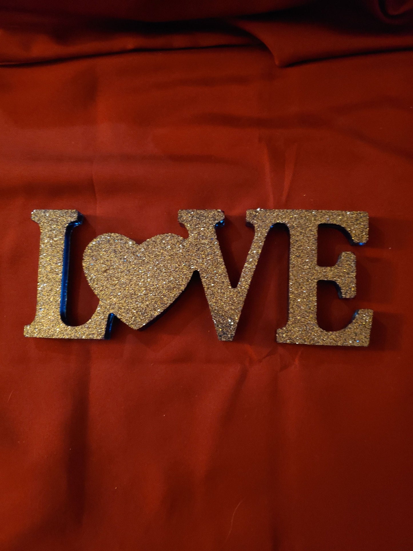 Inspirational signs... "Live," "Laugh," "Love," "Blessed." Resin signs.